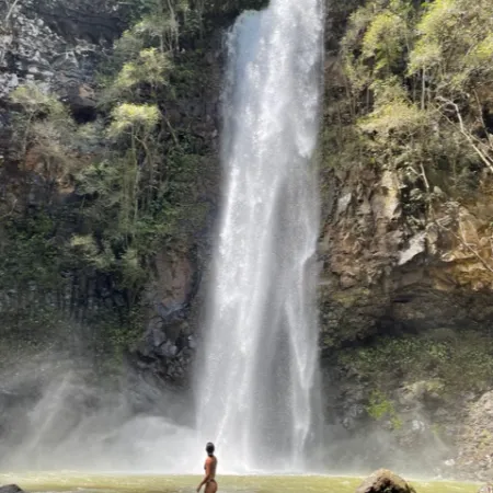 a large waterfall over a body of water